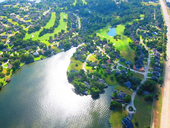 aerial view of Lake Conroe with beautiful waterfront estates and Margaritaville in the background